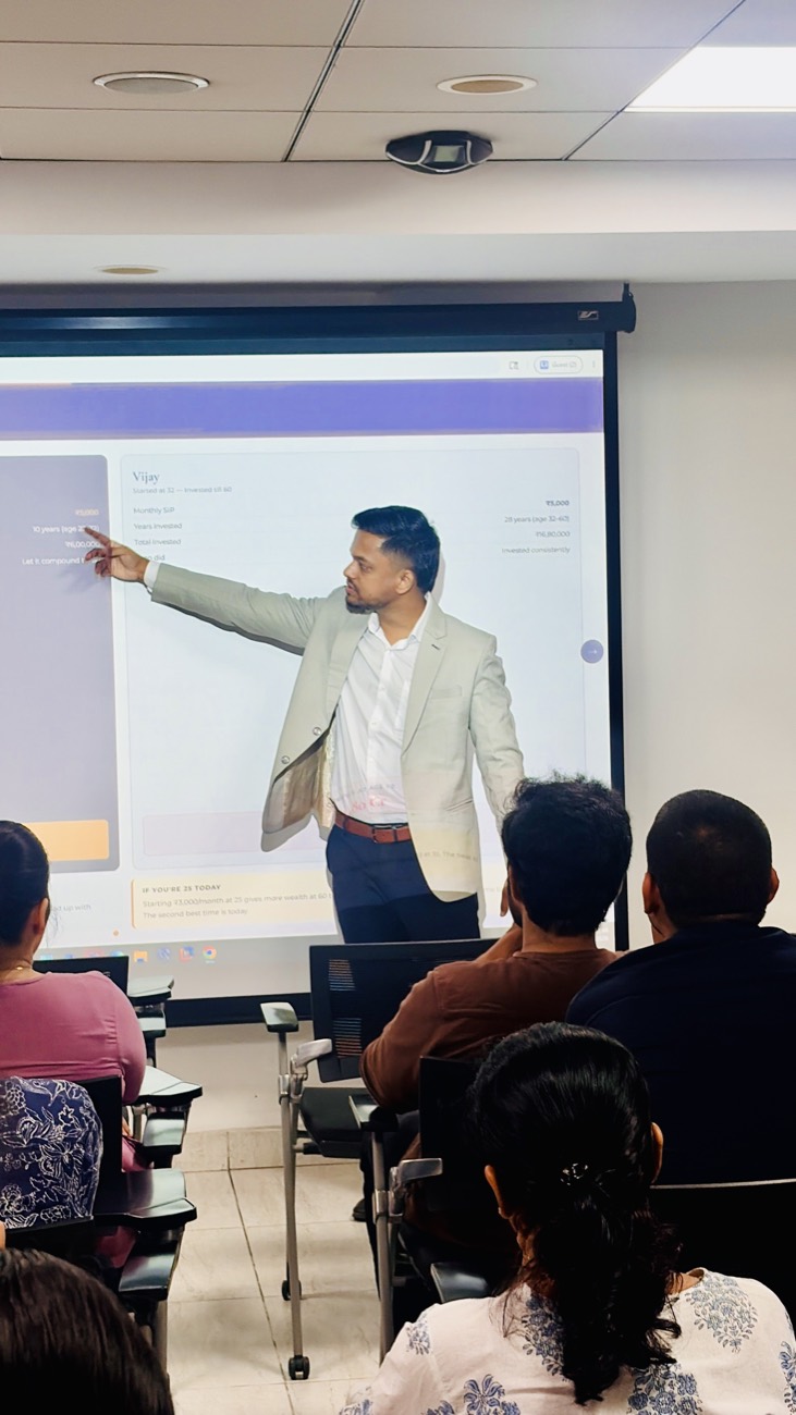 Employees attending a Mintra on-site financial wellness workshop in Hyderabad, learning about SIPs and compounding